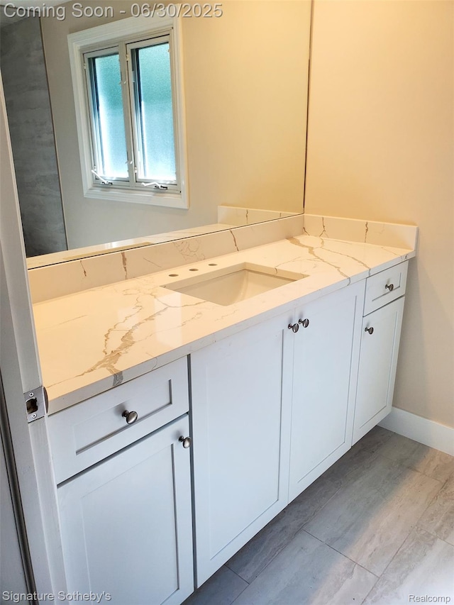 2200 Brenthaven Dr E, Bloomfield, MI 48304 - bathroom featuring vanity and baseboards