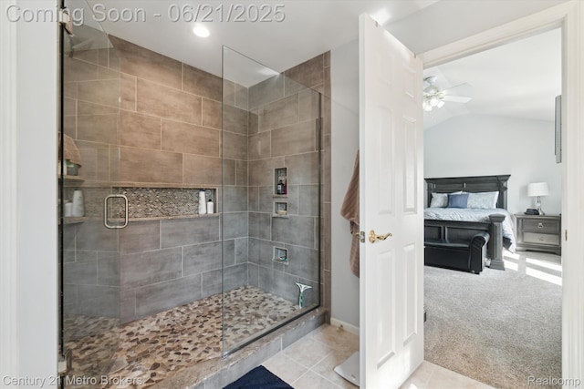 9145 Woodridge Dr, Davison, MI 48423 - ensuite bathroom with a stall shower, lofted ceiling, a ceiling fan, and tile patterned flooring