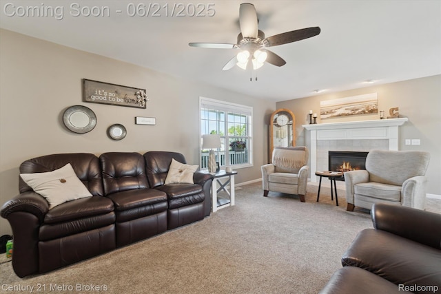 9145 Woodridge Dr, Davison, MI 48423 - living room featuring a tiled fireplace, ceiling fan, and carpet