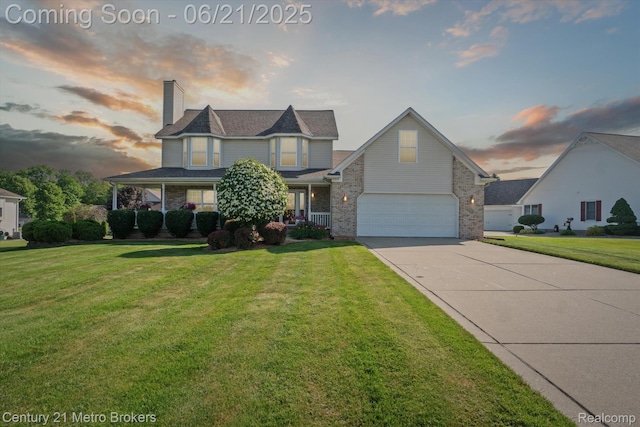9145 Woodridge Dr, Davison, MI 48423 - victorian home with driveway, a chimney, a yard, an attached garage, and brick siding