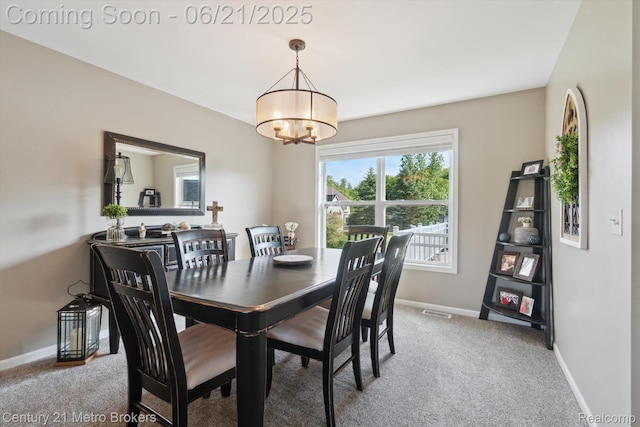 9145 Woodridge Dr, Davison, MI 48423 - carpeted dining space featuring a chandelier and baseboards