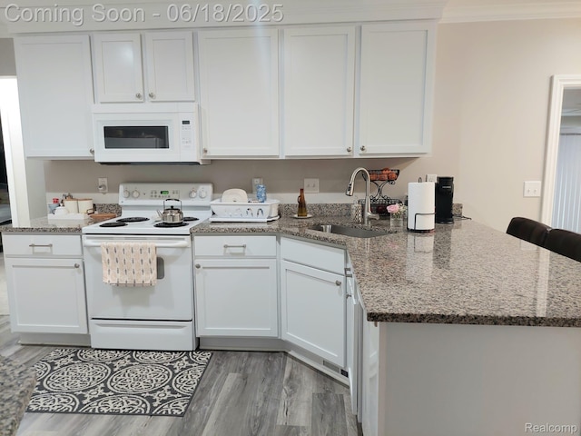 679 Judith St, Westland, MI 48186 - kitchen featuring white appliances, white cabinetry, light wood-style floors, and crown molding