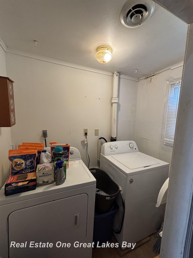 1521 Stanley St, Saginaw, MI 48602 - laundry area with washer and dryer and crown molding