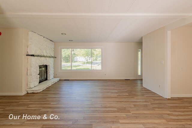 838 S Grey Rd, Midland, MI 48640 - unfurnished living room featuring light wood-type flooring, a fireplace, and recessed lighting