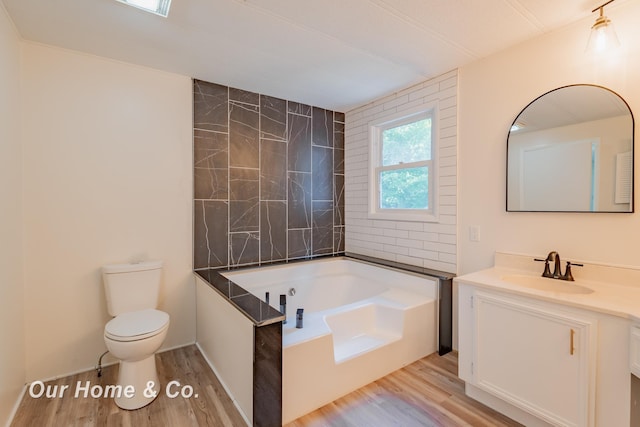 838 S Grey Rd, Midland, MI 48640 - full bath with a garden tub, vanity, and wood finished floors