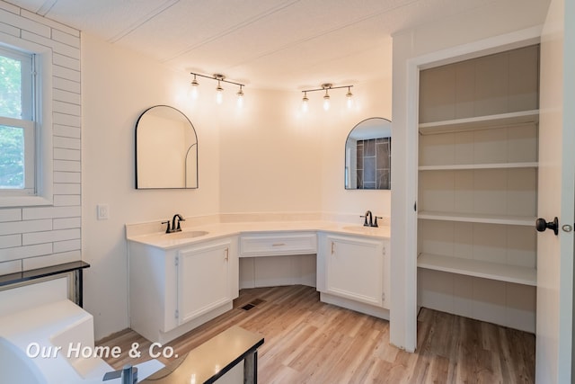 838 S Grey Rd, Midland, MI 48640 - full bathroom with wood finished floors and double vanity