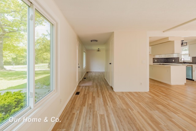 838 S Grey Rd, Midland, MI 48640 - hall with light wood-type flooring and a sink