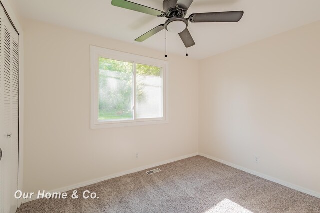 838 S Grey Rd, Midland, MI 48640 - unfurnished bedroom with carpet, a closet, and a ceiling fan