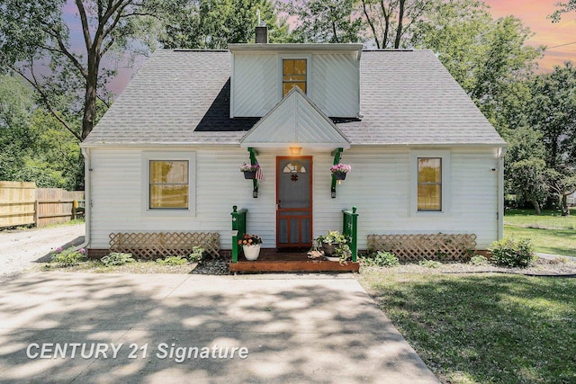 5430 N Center Rd, Saginaw, MI 48604 - view of front of house with a chimney and a shingled roof