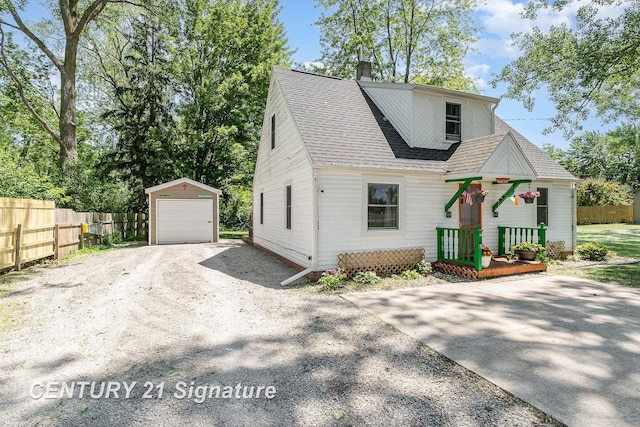 5430 N Center Rd, Saginaw, MI 48604 - view of front of property with an outdoor structure, a garage, a chimney, and roof with shingles