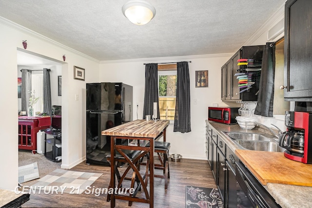 5430 N Center Rd, Saginaw, MI 48604 - kitchen with black appliances, ornamental molding, a textured ceiling, dark wood-style flooring, and wood counters