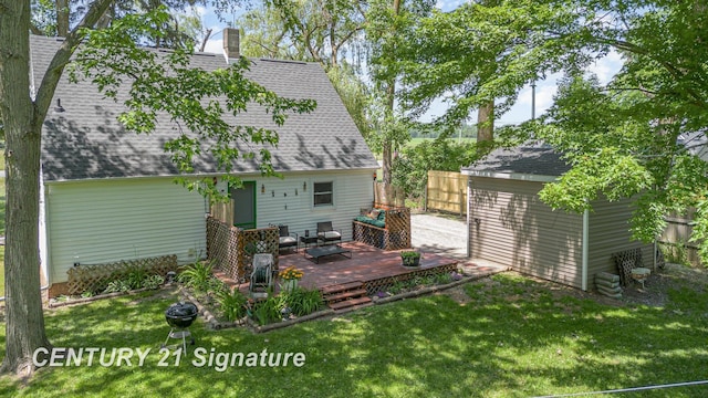 5430 N Center Rd, Saginaw, MI 48604 - rear view of house with roof with shingles, a chimney, a deck, a storage shed, and an outdoor hangout area