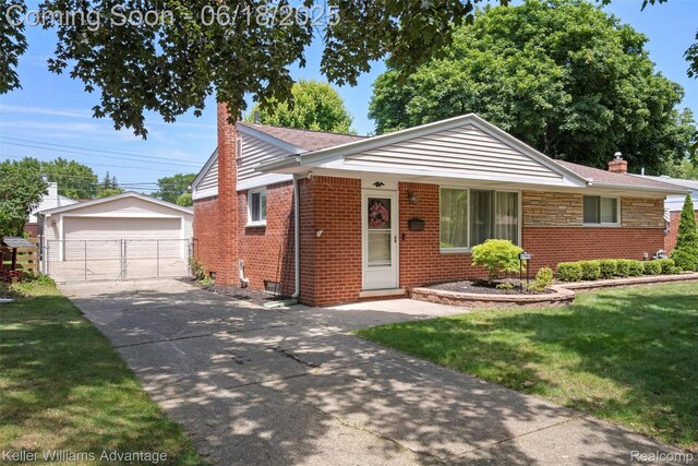 37862 Parkhurst St, Livonia, MI 48154 - view of front of property featuring a chimney, a front lawn, brick siding, an outbuilding, and a detached garage