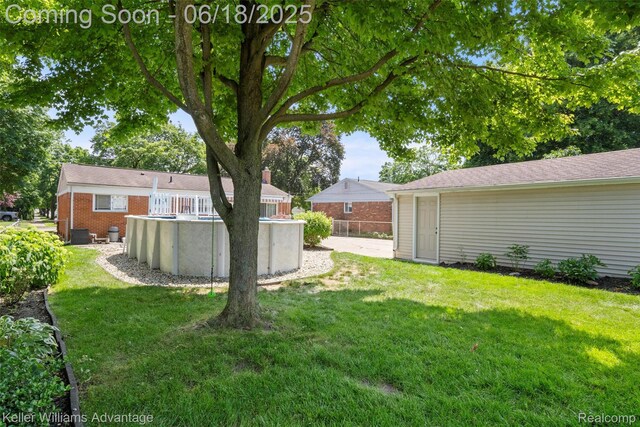 37862 Parkhurst St, Livonia, MI 48154 - view of grassy yard featuring an outdoor pool