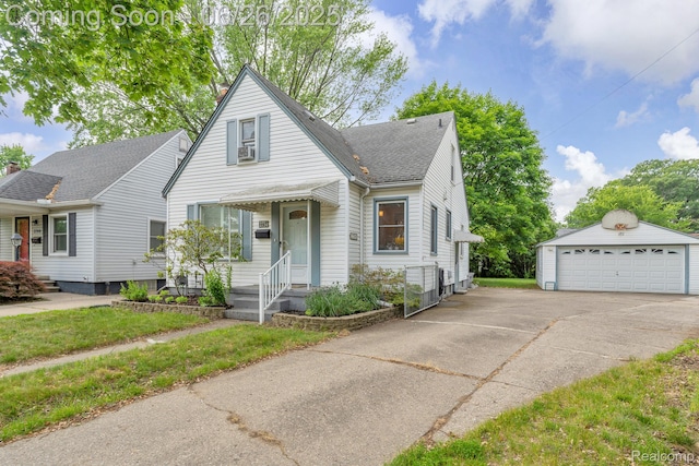 2734 Vassar St, Dearborn, MI 48124 - view of front of home featuring an outdoor structure, a garage, and roof with shingles
