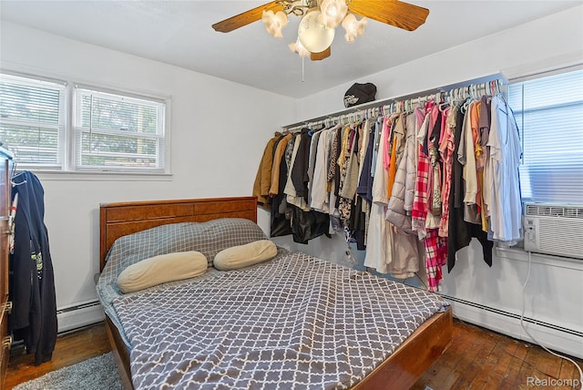 11228 Hudson Ave, Warren, MI 48089 - walk in closet with ceiling fan, hardwood / wood-style flooring, and a baseboard heating unit