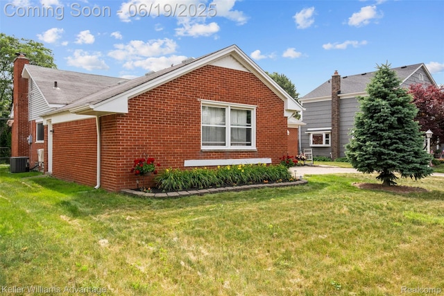 14000 Ellen Dr, Livonia, MI 48154 - view of home's exterior with brick siding and a yard