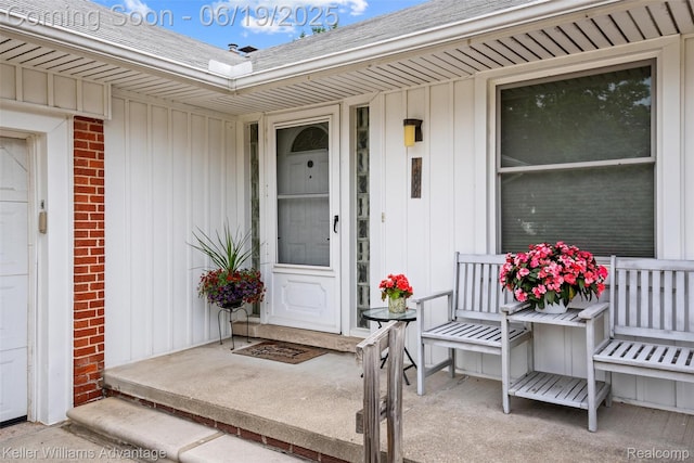 14000 Ellen Dr, Livonia, MI 48154 - entrance to property with board and batten siding, brick siding, and roof with shingles