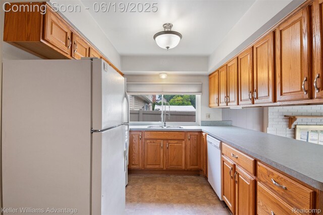 14000 Ellen Dr, Livonia, MI 48154 - kitchen with white appliances, brown cabinetry, light floors, and light countertops