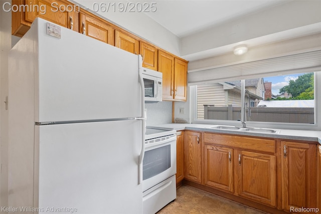 14000 Ellen Dr, Livonia, MI 48154 - kitchen with white appliances, brown cabinetry, and light countertops
