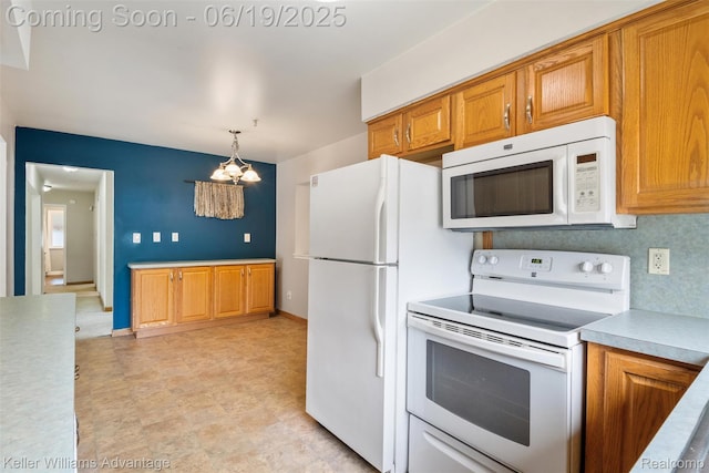 14000 Ellen Dr, Livonia, MI 48154 - kitchen with white appliances, light countertops, brown cabinetry, a chandelier, and pendant lighting