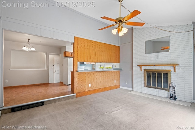 14000 Ellen Dr, Livonia, MI 48154 - unfurnished living room with carpet, ceiling fan, a chandelier, and a fireplace with flush hearth