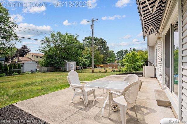 14000 Ellen Dr, Livonia, MI 48154 - view of patio / terrace with outdoor dining area and a storage unit