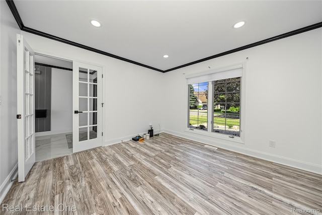 52615 Seven Oaks Dr, Shelby Twp, MI 48316 - empty room featuring french doors, crown molding, recessed lighting, and wood finished floors