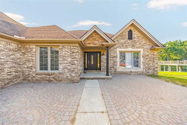 52615 Seven Oaks Dr, Shelby Twp, MI 48316 - doorway to property with brick siding