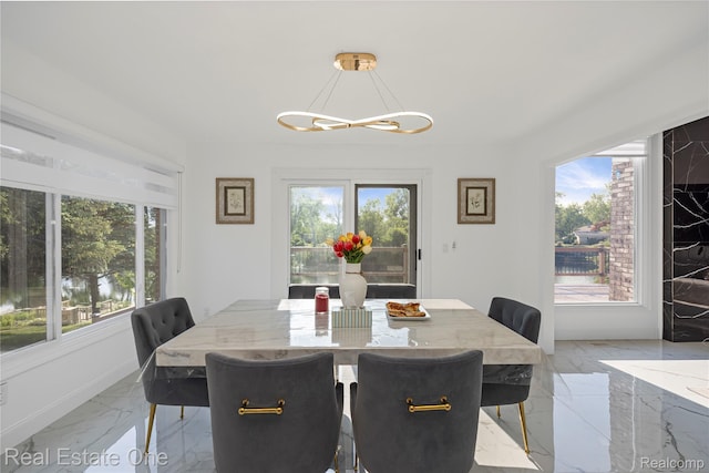 52615 Seven Oaks Dr, Shelby Twp, MI 48316 - dining area with light marble finish floors and a chandelier