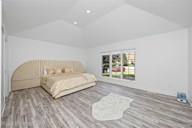 52615 Seven Oaks Dr, Shelby Twp, MI 48316 - bedroom with lofted ceiling, wood finished floors, and recessed lighting