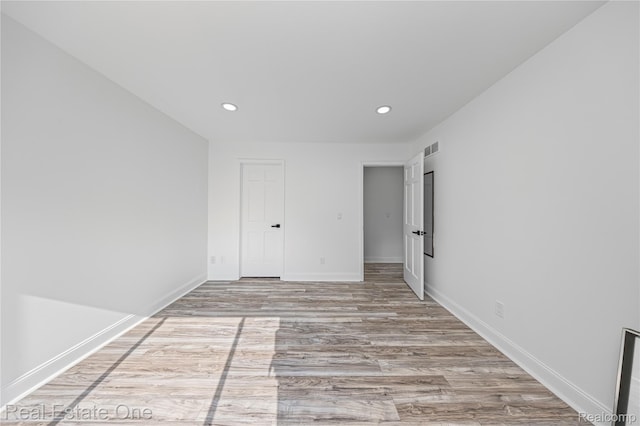 52615 Seven Oaks Dr, Shelby Twp, MI 48316 - empty room with recessed lighting and wood finished floors
