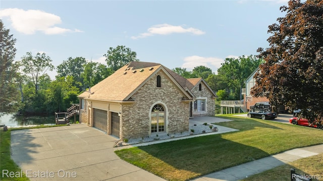 52615 Seven Oaks Dr, Shelby Twp, MI 48316 - view of front of property with brick siding, a front lawn, concrete driveway, an attached garage, and a shingled roof