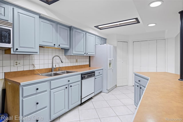 52615 Seven Oaks Dr, Shelby Twp, MI 48316 - kitchen featuring white appliances, light countertops, decorative backsplash, and recessed lighting
