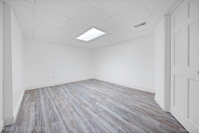 52615 Seven Oaks Dr, Shelby Twp, MI 48316 - unfurnished room featuring wood finished floors and a paneled ceiling