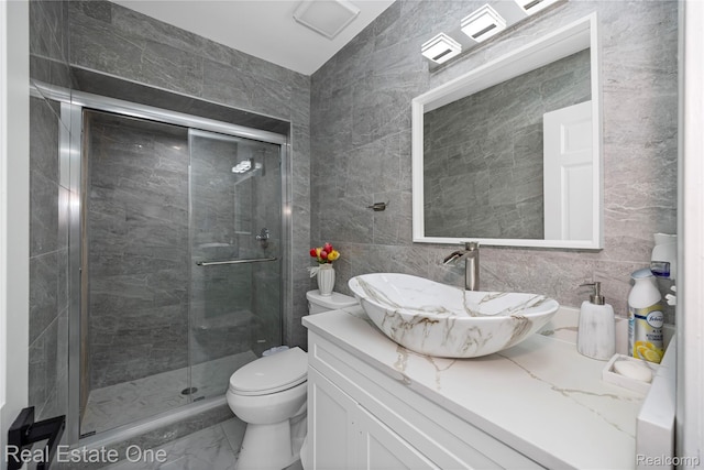 52615 Seven Oaks Dr, Shelby Twp, MI 48316 - bathroom with tile walls, marble look tile flooring, vanity, and a stall shower