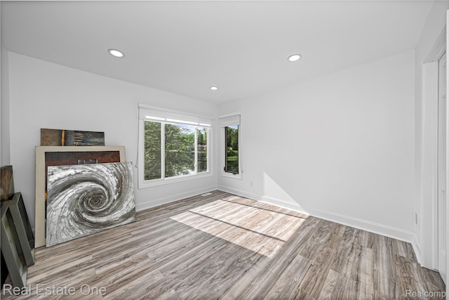 52615 Seven Oaks Dr, Shelby Twp, MI 48316 - unfurnished living room featuring wood finished floors and recessed lighting