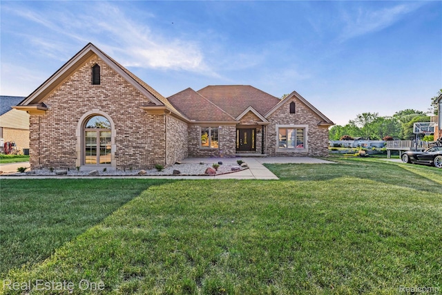 52615 Seven Oaks Dr, Shelby Twp, MI 48316 - view of front of house with a front lawn, brick siding, and a shingled roof
