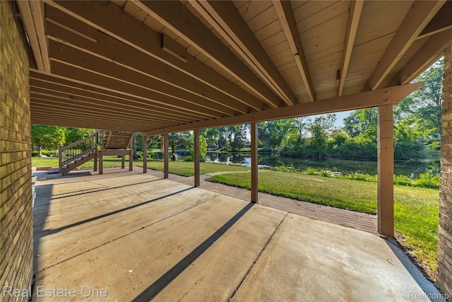 52615 Seven Oaks Dr, Shelby Twp, MI 48316 - view of patio / terrace with a water view, stairs, and view of wooded area
