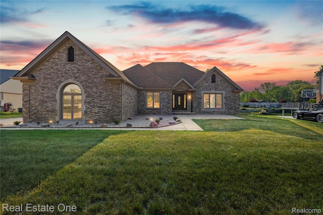 52615 Seven Oaks Dr, Shelby Twp, MI 48316 - french country style house with a front yard and brick siding