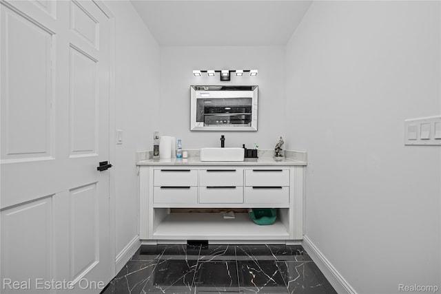 52615 Seven Oaks Dr, Shelby Twp, MI 48316 - bathroom featuring marble finish floors and vanity