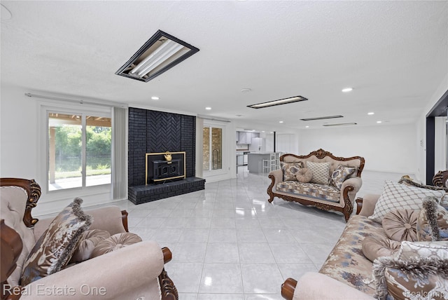 52615 Seven Oaks Dr, Shelby Twp, MI 48316 - living area featuring light tile patterned floors, a fireplace, recessed lighting, and a textured ceiling
