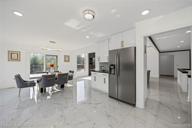 52615 Seven Oaks Dr, Shelby Twp, MI 48316 - kitchen featuring stainless steel fridge with ice dispenser, white cabinets, light marble finish floors, dark countertops, and modern cabinets