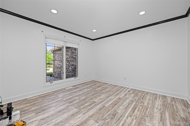 52615 Seven Oaks Dr, Shelby Twp, MI 48316 - spare room featuring ornamental molding, light wood-style floors, and recessed lighting