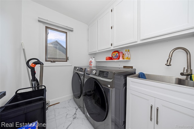 52615 Seven Oaks Dr, Shelby Twp, MI 48316 - washroom with cabinet space, light marble finish floors, and separate washer and dryer