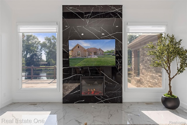 52615 Seven Oaks Dr, Shelby Twp, MI 48316 - doorway to outside with plenty of natural light and marble finish floors