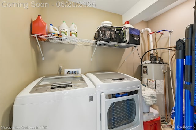 11693 Kenton Dr, Whitmore Lake, MI 48189 - laundry area with water heater and washer and clothes dryer