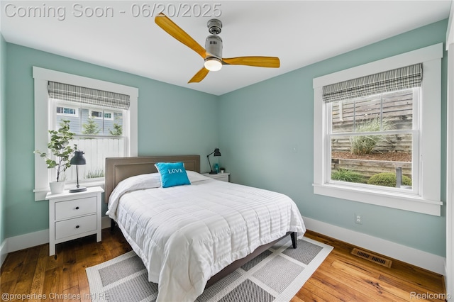 11693 Kenton Dr, Whitmore Lake, MI 48189 - bedroom featuring multiple windows, wood finished floors, and ceiling fan