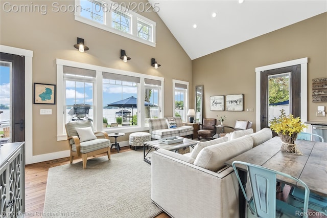 11693 Kenton Dr, Whitmore Lake, MI 48189 - living room featuring high vaulted ceiling, light wood-style floors, and recessed lighting