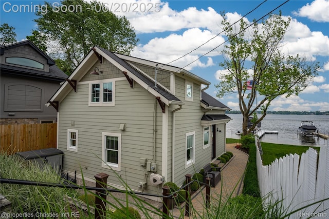 11693 Kenton Dr, Whitmore Lake, MI 48189 - view of side of home featuring a water view